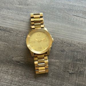 Gold Nixon watch men’s. Will need to replace watch
